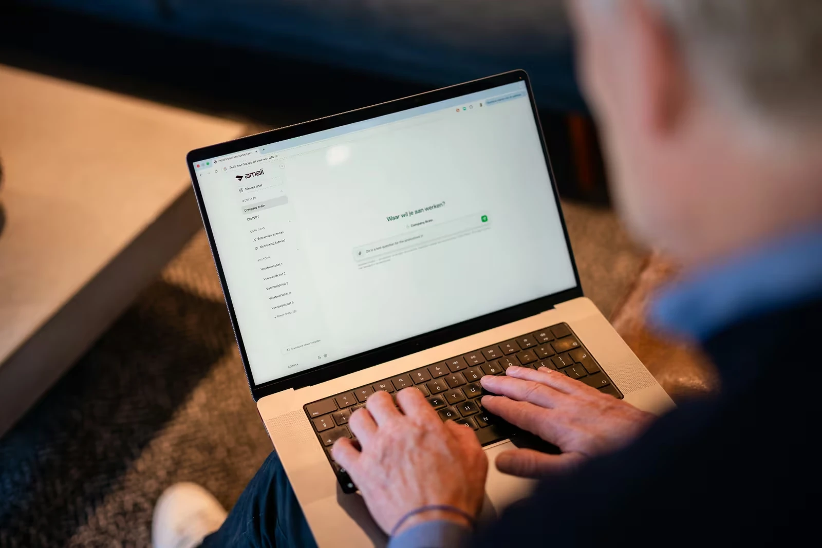 Over-the-shoulder view of a user with the Amaii interface visible on screen